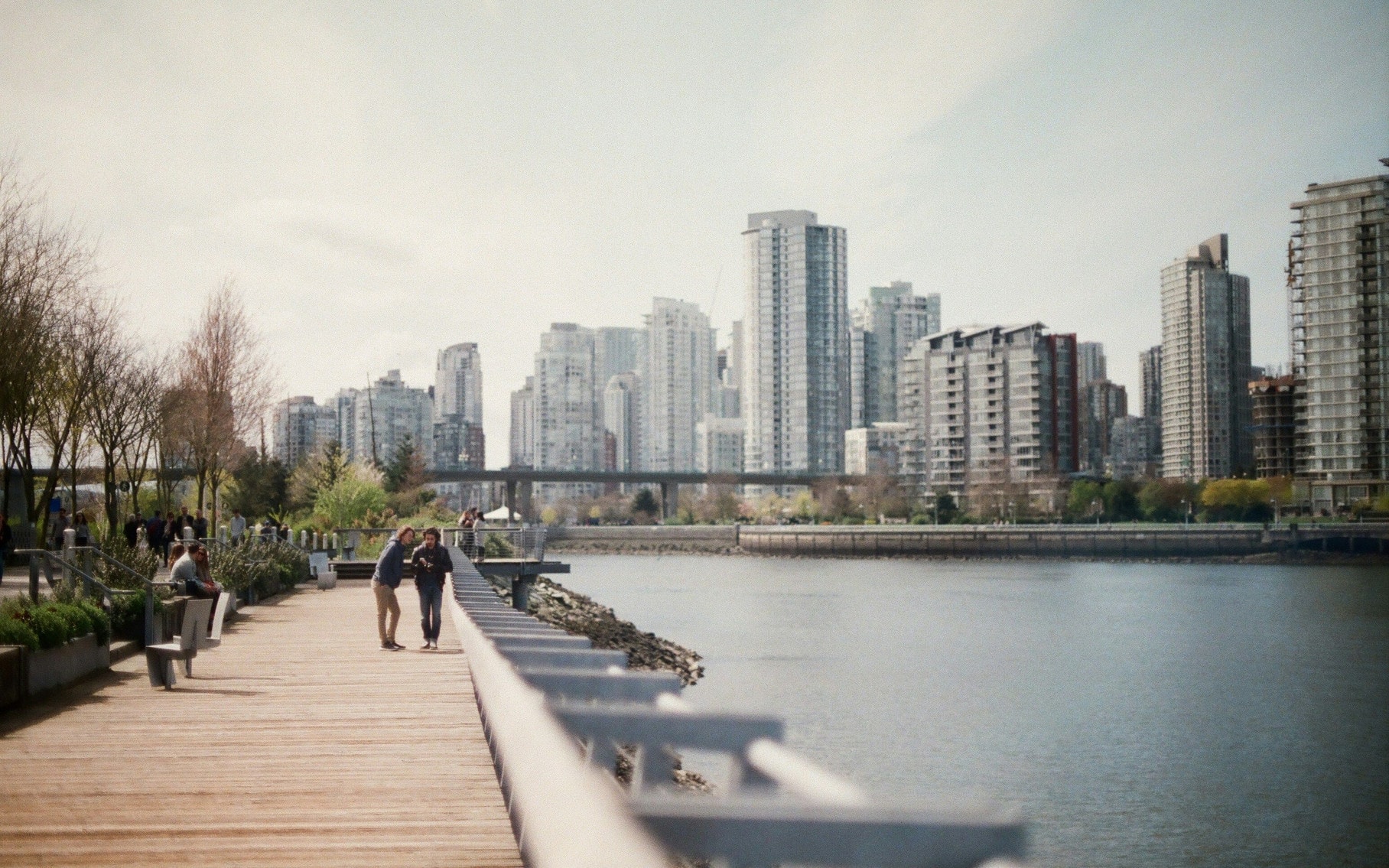 People Walking on the Seawall in Vancouver's False Creek